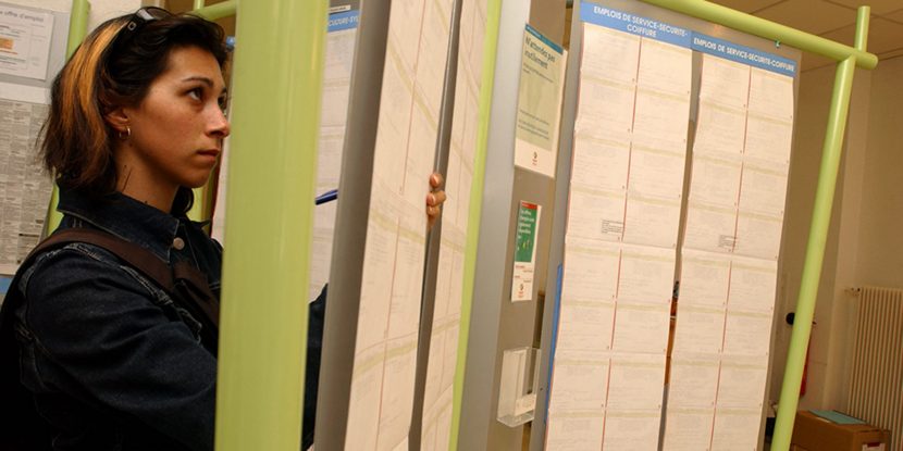 Young woman looking at a poster