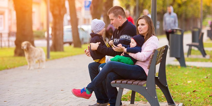 Happy family in a city park